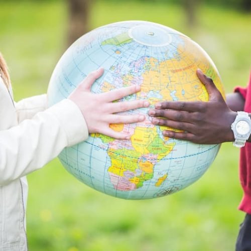 multiracial-teen-couple-holding-globe-map-2025-01-08-03-58-34-utc-1.jpg